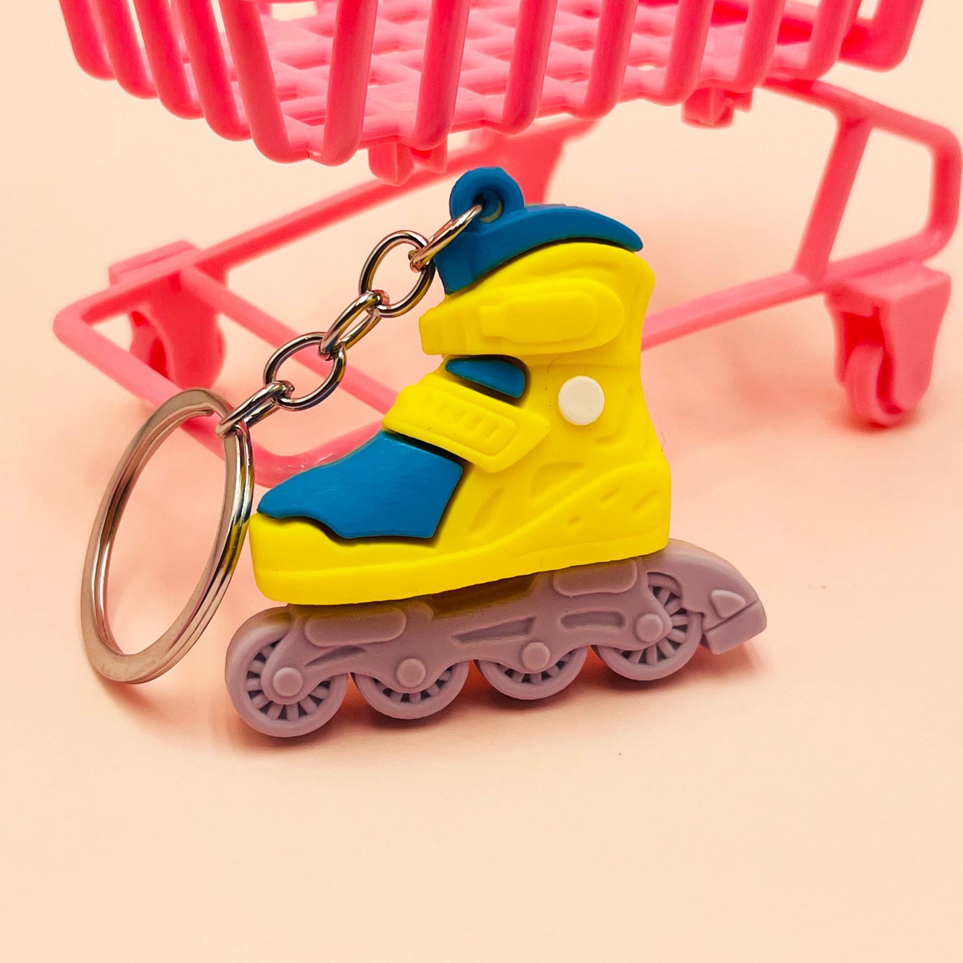 Venta al por mayor de patines de ruedas de PVC llavero creativo de plástico blando